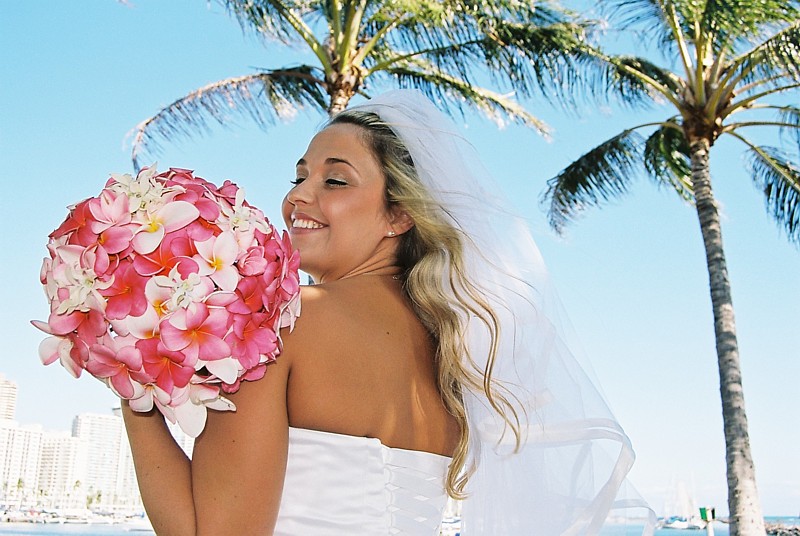 Multi color pink plumeria bouquet at magic island in Honolulu Waikiki for a bride